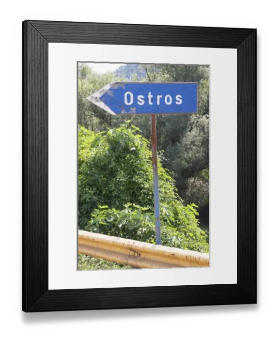Framed Print : Blue rusty Road side sign pointing left saying Ostros. Near Dupilo, Golubovic Montenegro Framed Print : Blue rusty Road side sign pointing left saying Ostros. Near Dupilo, Golubovic Montenegro