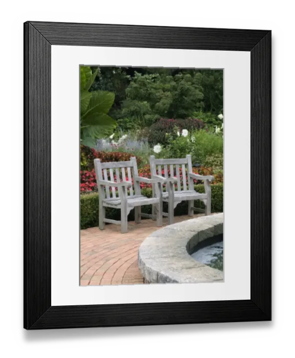 Framed Print : Empty wooden chairs along a garden path Framed Print : Empty wooden chairs along a garden path