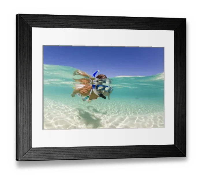 Framed Print : couple (age 23 and 24) enjoying snorkeling the clear tropical waters of a remote island Framed Print : couple (age 23 and 24) enjoying snorkeling the clear tropical waters of a remote island