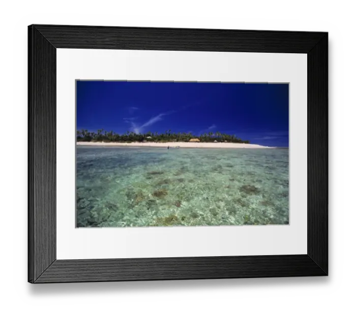 Framed Print : Fiji Islands, Tavarua. The simple resort at Tavarua is upstaged by the aquamarine waters