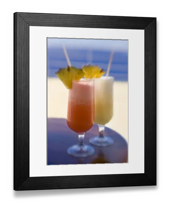 Framed Print : French Polynesia. Tropical drinks with pineapple garnish