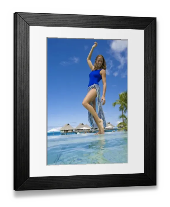 Framed Print : South Pacific, Bora Bora, Female tourist poolside. (PR / MR) Framed Print : South Pacific, Bora Bora, Female tourist poolside. (PR / MR)