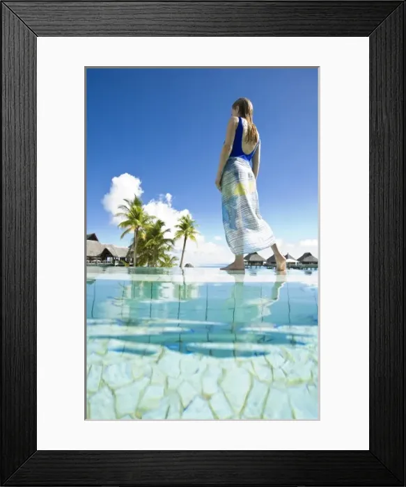 Framed Print : South Pacific, Bora Bora, female tourist relaxing at resort. (MR)