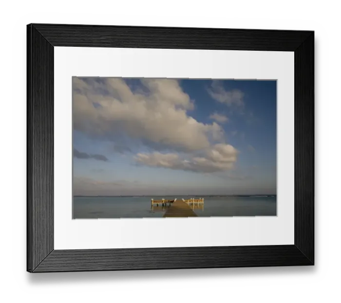 Framed Print : Cayman Islands, Little Cayman Island, Setting sun lights wooden boat pier in Caribbean