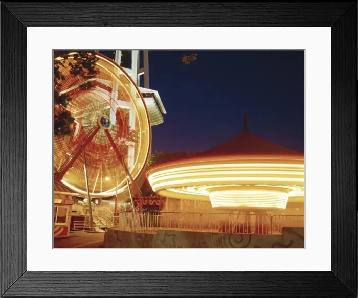 Framed Print : The Fun Forest amusment park at the Seattle Center, Ferries Wheel and Merry-go-Round in motion Framed Print : The Fun Forest amusment park at the Seattle Center, Ferries Wheel and Merry-go-Round in motion