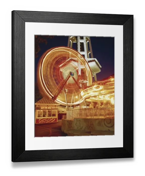 Framed Print : The Fun Forest at the Seattle Center with the Ferries Wheel and Merry-go-Round in motion