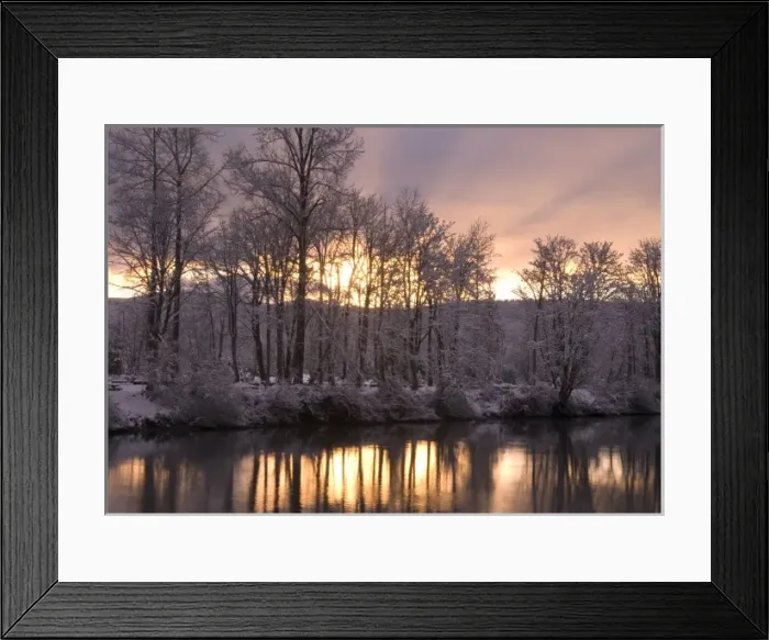 Framed Print : Sunset behind snow dusted trees reflecting in the Snoqualmie River, Washington