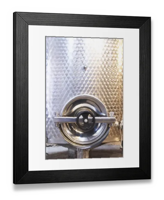 Framed Print : Stainless steel fermentation and storage tanks in the underground cellar. Detail of door Framed Print : Stainless steel fermentation and storage tanks in the underground cellar. Detail of door