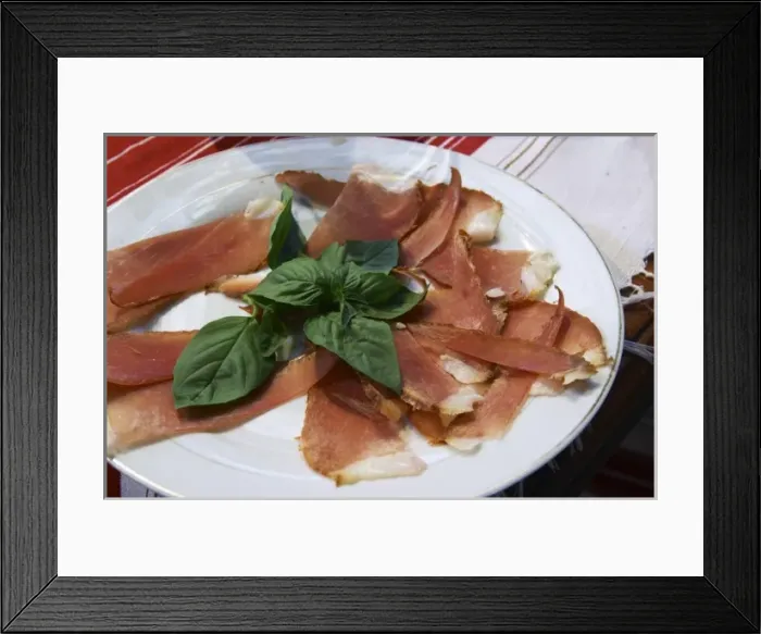 Framed Print : Dried dry cured ham with basil leaves on a white plate. Tradita traditional restaurant, Shkodra Framed Print : Dried dry cured ham with basil leaves on a white plate. Tradita traditional restaurant, Shkodra