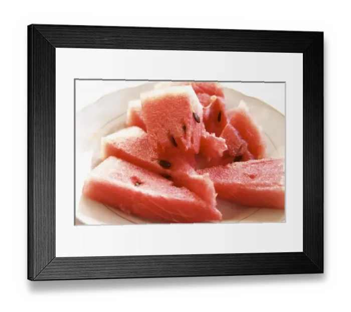 Framed Print : Triangular pieces of red water melon Shalqi on a white plate. Berat lower town. Albania