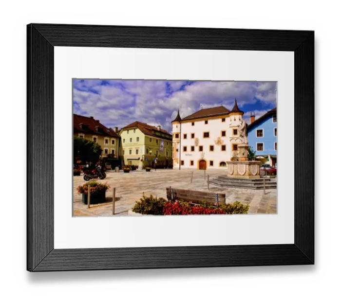 Framed Print : Town square in Mauterndorf Austria with flowers and colorful buildings