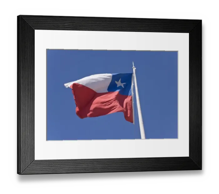 Framed Print : Chile, Patagonia, Punta Arenas. Chilean flag waves against blue sky