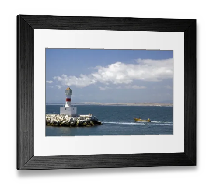 Framed Print : Lighthouse and motor boat off the coast of Concon in the Valparaiso Region of Chile