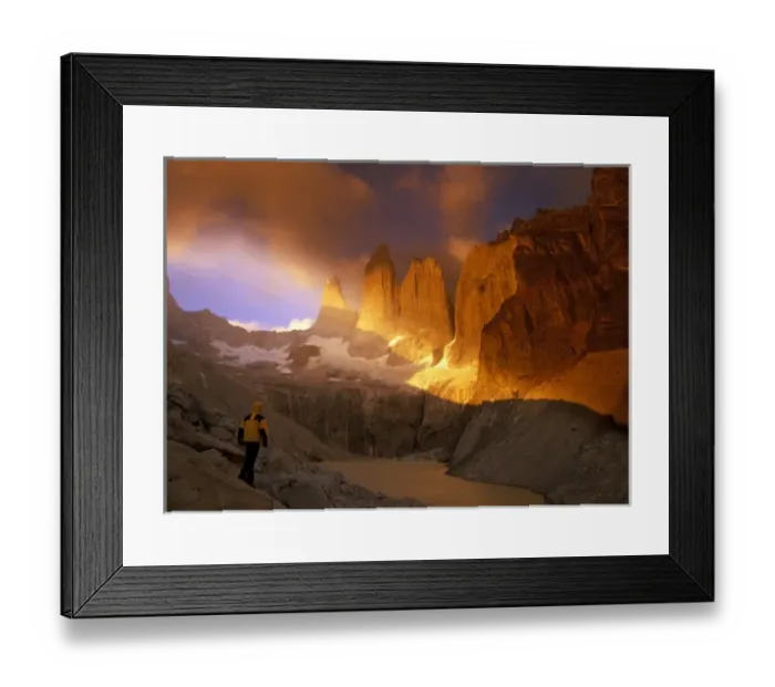 Framed Print : Man in yellow jacket watches as clouds swirl around Cerro del Torres in Patagonia, Chile Framed Print : Man in yellow jacket watches as clouds swirl around Cerro del Torres in Patagonia, Chile