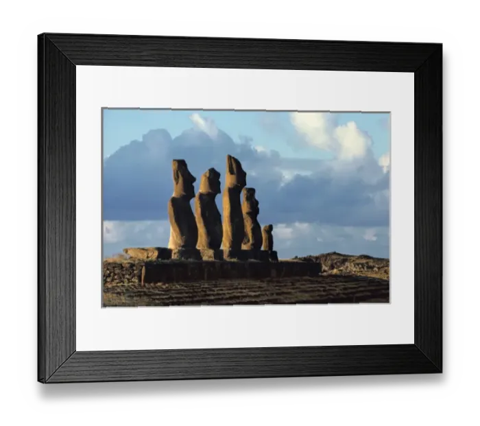 Framed Print : South America, Chile, Easter Island. Warm backlighting silhouettes the moai Framed Print : South America, Chile, Easter Island. Warm backlighting silhouettes the moai