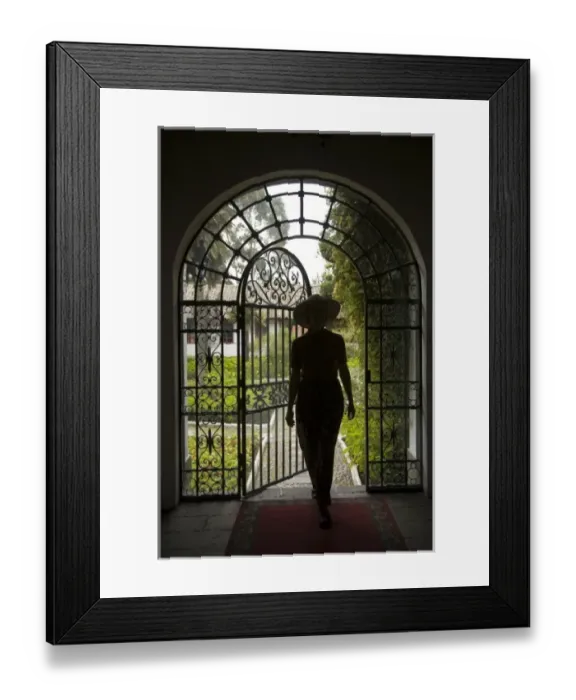 Framed Print : Ecuador, Lasso, woman in arch with wrought-iron door to garden, Hacienda La Cienega (MR) Framed Print : Ecuador, Lasso, woman in arch with wrought-iron door to garden, Hacienda La Cienega (MR)