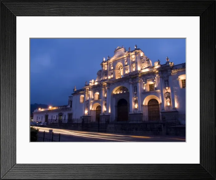 Framed Print : Evening at Cathedral de Santiago at twilight with streaks of traffic in town of Antigua