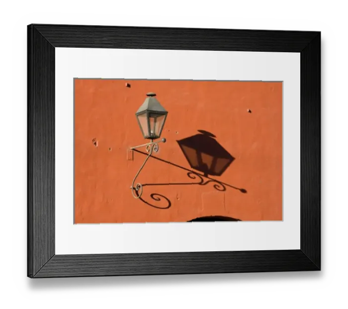 Framed Print : Guatemala, Antigua. A lantern with shadow on a colorful wall in the town of Antigua