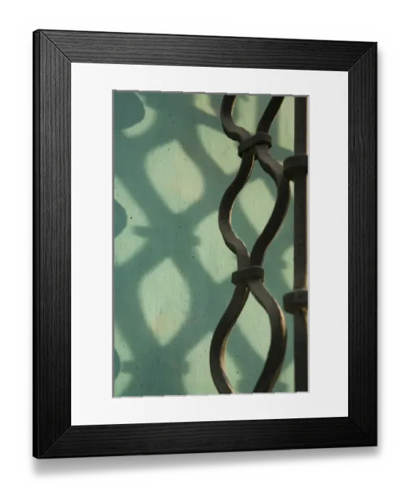 Framed Print : Guatemala, Antigua. Wrought-iron window grate, with shadows on turquoise wall
