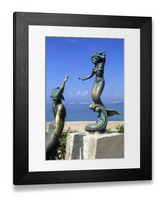 Framed Print : Statues of bronze mermaids on the beach in Puerto Vallarta Mexico Framed Print : Statues of bronze mermaids on the beach in Puerto Vallarta Mexico