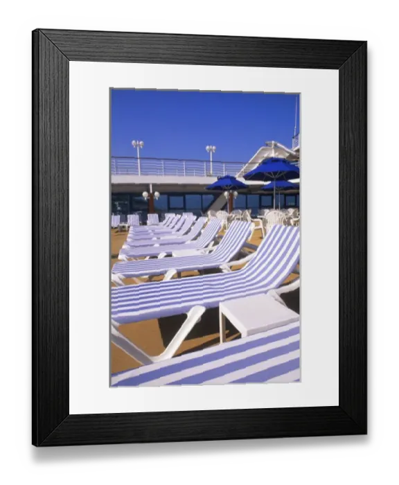 Framed Print : Lounge chairs, tables, umbrellas on the deck of a cruise ship Framed Print : Lounge chairs, tables, umbrellas on the deck of a cruise ship