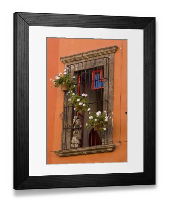 Framed Print : Mexico, San Miguel de Allende. Flower pots decorate window with iron grill and statue Framed Print : Mexico, San Miguel de Allende. Flower pots decorate window with iron grill and statue