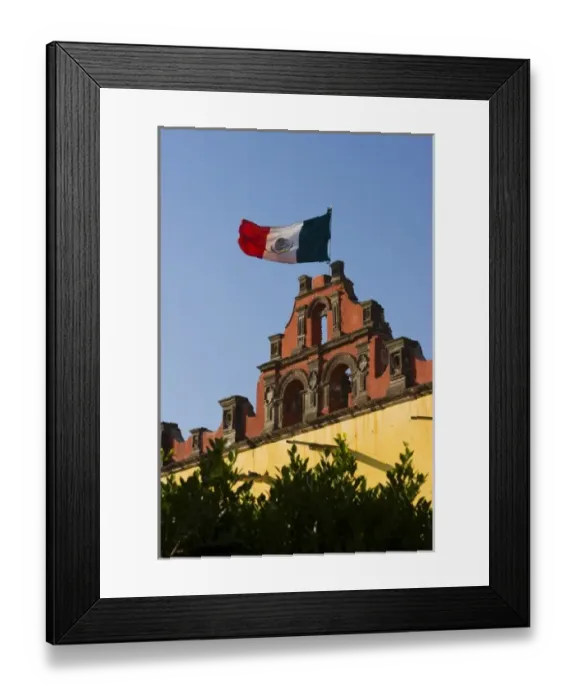 Framed Print : Mexico, San Miguel de Allende. Mexican flag flies in breeze atop Colegio de Sales school Framed Print : Mexico, San Miguel de Allende. Mexican flag flies in breeze atop Colegio de Sales school