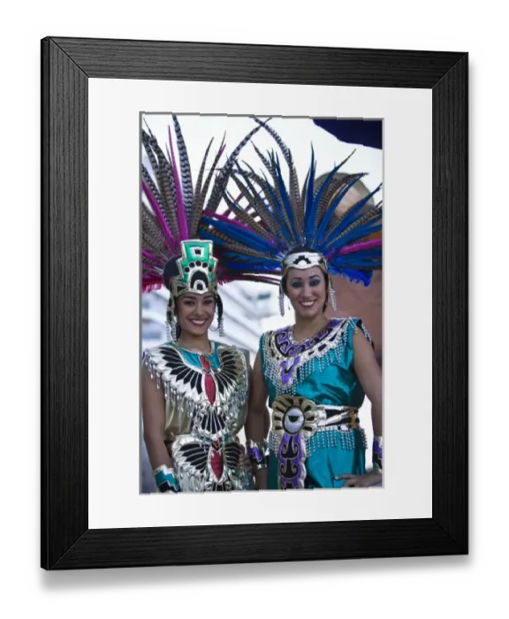 Framed Print : 22 year old Hispanic sisters, Aztec outfits, feather head dress with Pheasant feathers Framed Print : 22 year old Hispanic sisters, Aztec outfits, feather head dress with Pheasant feathers
