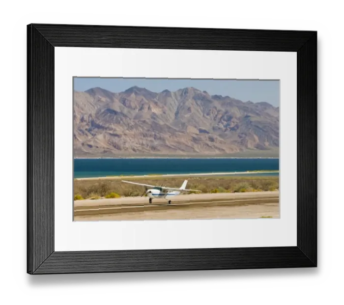 Framed Print : Mexico, Baja California, Bahia de los Angeles. Small aircraft lands with dramatic