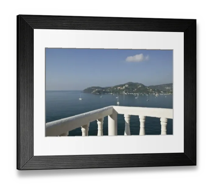 Framed Print : Mexico, Guerrero, Zihuatanejo. Cafe Table over Zihuatanejo Bay