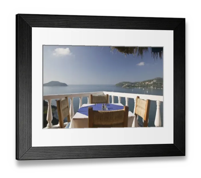 Framed Print : Mexico, Guerrero, Zihuatanejo. Cafe Table over Zihuatanejo Bay