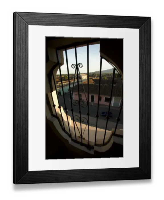 Framed Print : Nicaragua, Granada. Streets with pastel houses, viewed from above through iron grill Framed Print : Nicaragua, Granada. Streets with pastel houses, viewed from above through iron grill