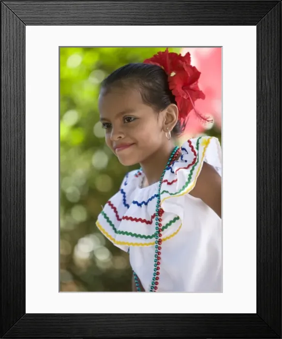 Framed Print : Nicaragua, Granada. Girl in traditional dress dancing in Villa Esperanza barrio. (MR)