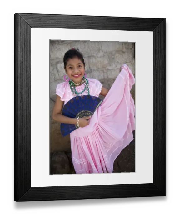 Framed Print : Nicaragua, Granada. Girl with fan in traditional dress after dance in Villa Esperanza barrio