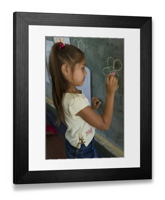 Framed Print : Nicaragua, Granada. Girl writing on blackboard in school classroom in Santa Ana de Malacos Framed Print : Nicaragua, Granada. Girl writing on blackboard in school classroom in Santa Ana de Malacos