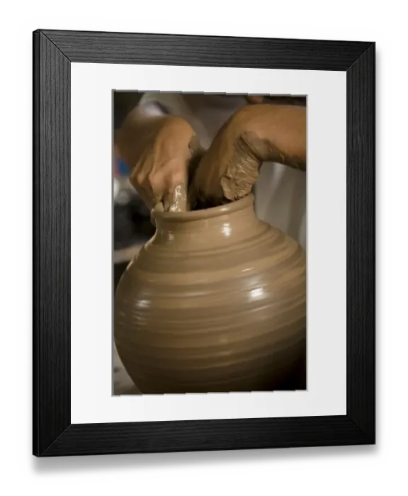 Framed Print : Nicaragua, Catarina. Potters hands creating clay pottery on spinning wheel