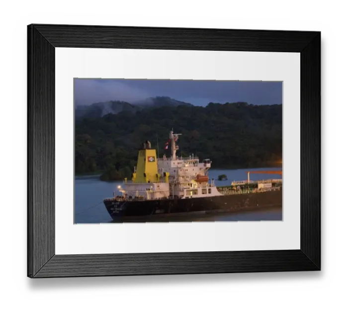 Framed Print : Panama, Panama Canal, ship in Panama Canal, rainforest in the background Framed Print : Panama, Panama Canal, ship in Panama Canal, rainforest in the background