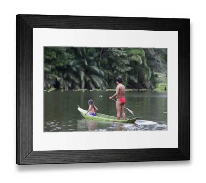 Framed Print : Goa Panama. A Wounaan father and daughter canoing down the charges river in the rain Framed Print : Goa Panama. A Wounaan father and daughter canoing down the charges river in the rain