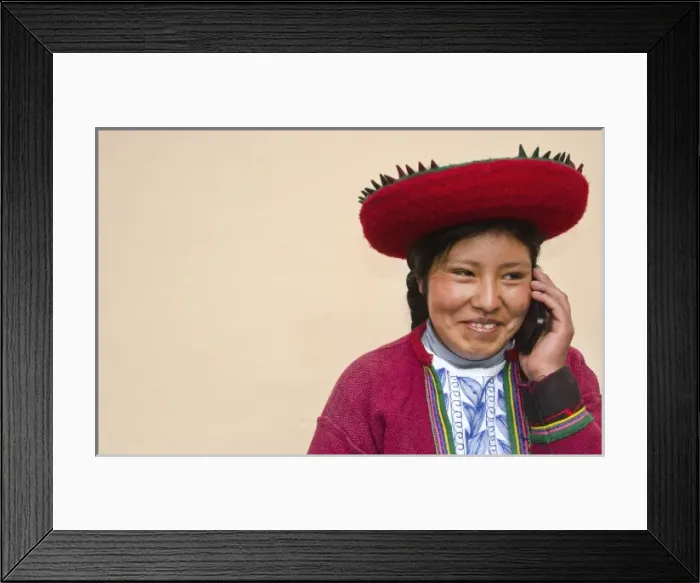 Framed Print : Modern life in Peru woman in traditional dress and hat with cell phone communicating via wireless Framed Print : Modern life in Peru woman in traditional dress and hat with cell phone communicating via wireless