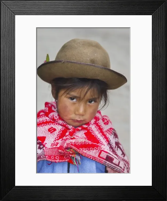 Framed Print : Portrait of young girl with traditional dress in small town of Pisaq Peru South America Framed Print : Portrait of young girl with traditional dress in small town of Pisaq Peru South America