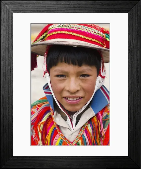 Framed Print : Portrait of young boy, with traditional dress in small town of Pisaq Peru South America Framed Print : Portrait of young boy, with traditional dress in small town of Pisaq Peru South America