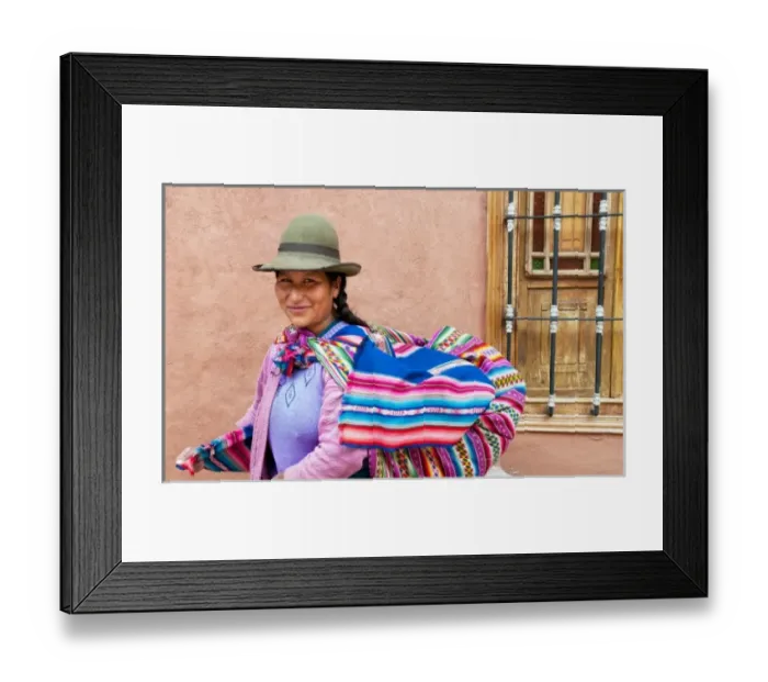 Framed Print : Traditional woman in dress and hat with baby on back in small town of Pisaq Peru