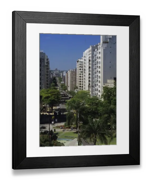 Framed Print : South America, Uruguay, Montevideo, sun-washed while buildings line a bisy residential Framed Print : South America, Uruguay, Montevideo, sun-washed while buildings line a bisy residential