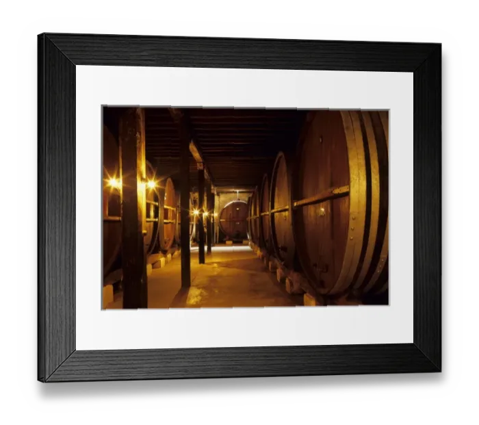 Framed Print : South America, Uruguay; fine wine ages in oaken casks in a cool wine cellar