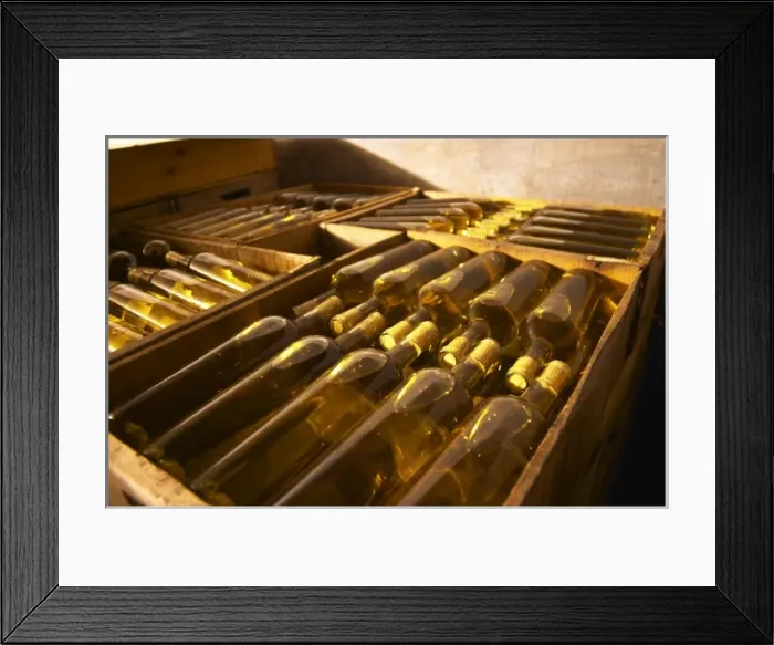 Framed Print : Bottles of white wine being aged in the cellar. Bodega Vinos Finos H Stagnari Winery Framed Print : Bottles of white wine being aged in the cellar. Bodega Vinos Finos H Stagnari Winery
