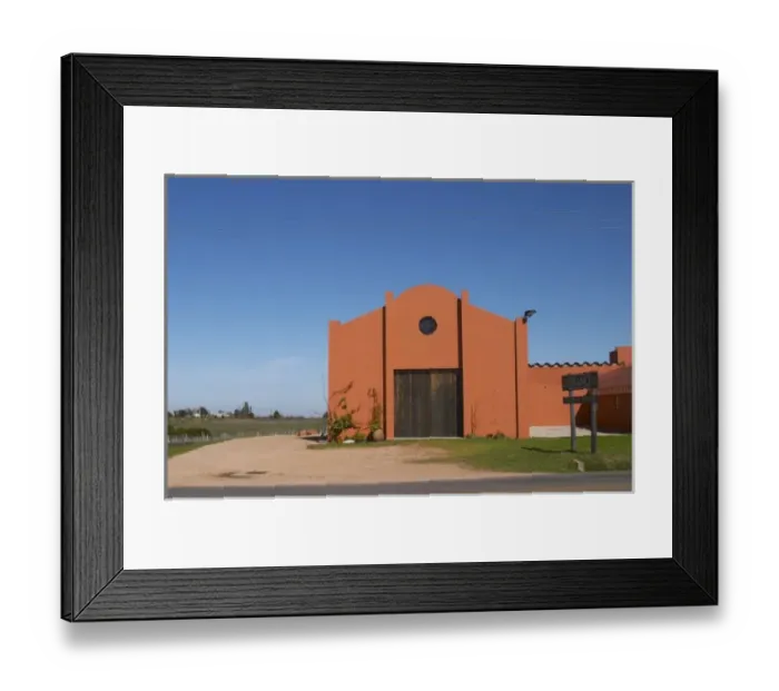 Framed Print : A view over the main winery building and a sign to the winery. Painted in ochre red Framed Print : A view over the main winery building and a sign to the winery. Painted in ochre red