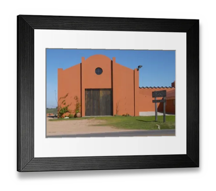 Framed Print : A view over the main winery building and a sign to the winery. Painted in ochre red Framed Print : A view over the main winery building and a sign to the winery. Painted in ochre red