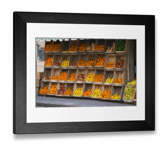 Framed Print : A fruit and vegetable shop displaying products in wooden crates on the street: tomatoes