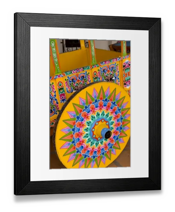 Framed Print : Colorful close up of famous wheel for carriages that are traditional in and around Framed Print : Colorful close up of famous wheel for carriages that are traditional in and around
