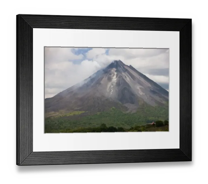 Framed Print : Lava rocks are thrown from the erupting Arenal volcano to the mountainside and forest